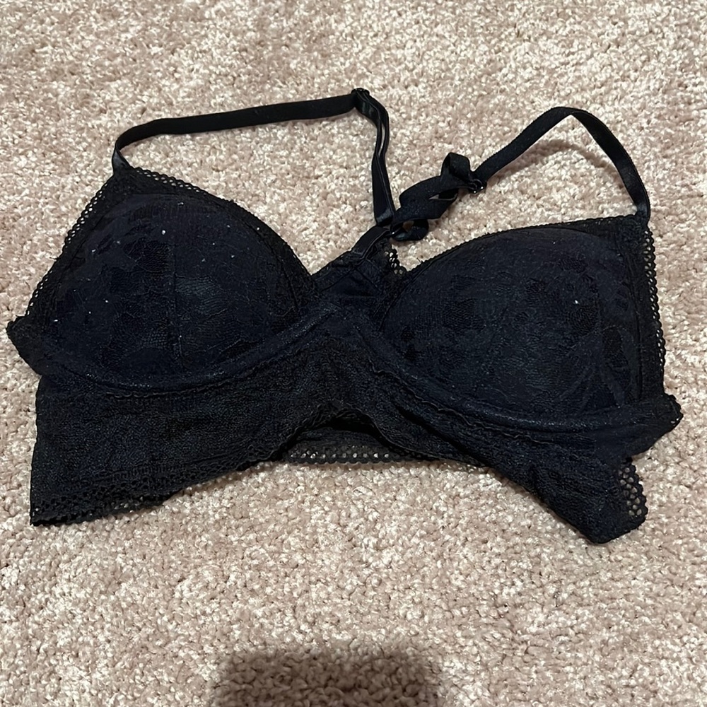 Black lace bralette. Racer back straps. Well loved. No rips in lace